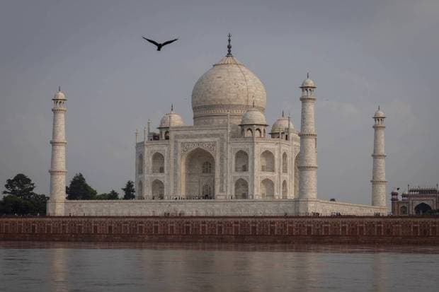 Tourists walk inside the historic Taj Mahal as the Yamuna river overflows following heavy rains, in Agra. REUTERS