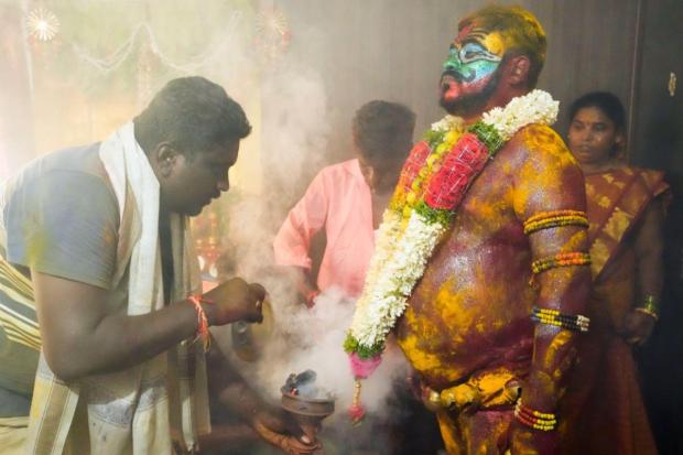 A devotee gets ready to play the role of Pothuraju, a mythical character, during the Bonalu festival in Hyderabad. Bonalu is a month-long Hindu folk festival of the Telangana region dedicated to Kali, the Hindu goddess of destruction. (Image/AP)Dates: Sometime in July-August