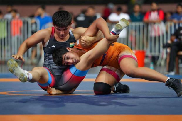 Manisha (in black) of Haryana and Sarika of Haryana compete in the women's 62kg category event during the Asian Games 2023 wrestling trials.