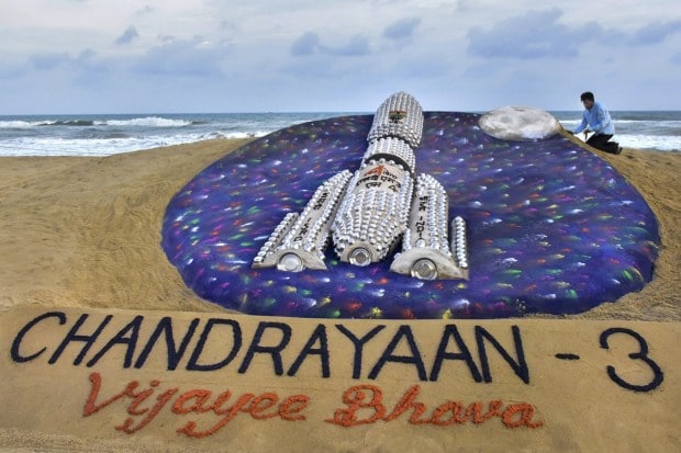 Artist Sudarsan Pattnaik creates a sand art to wish good luck to ISRO scientists for ISRO's Chandrayaan-3 mission at Odisha's Puri. (PTI Photo)