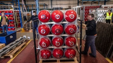 Employees bind hydrogen gas cylinders at the Calvera Hydrogen SA plant in Zaragoza, Spain. 
