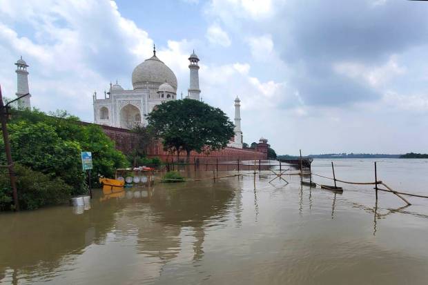 The swollen Yamuna river rises to the periphery of the Taj Mahal, in Agra. (AP Photo)