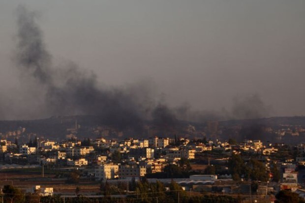 Smoke is seen from Israel's side during a raid on Jenin refugee camp in the Israeli-occupied West Bank, Jalamah checkpoint, on July 3, 2023. (Image: Reuters)