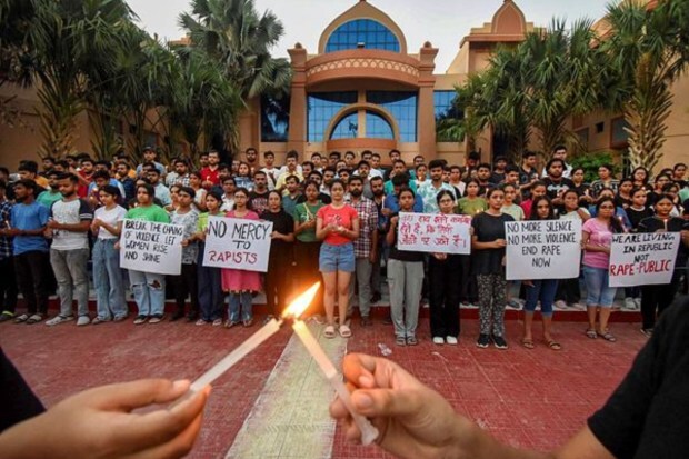  Students take part in a candle light protest in Patna on July 20. (Image: PTI)