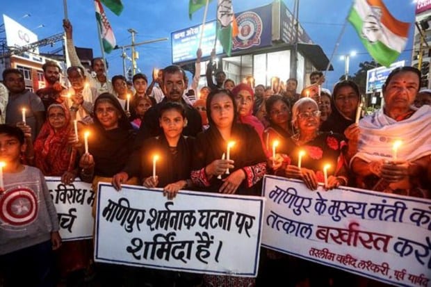 Congress workers take part in a candle march to protest in Bhopal on July 22. (Image: PTI)