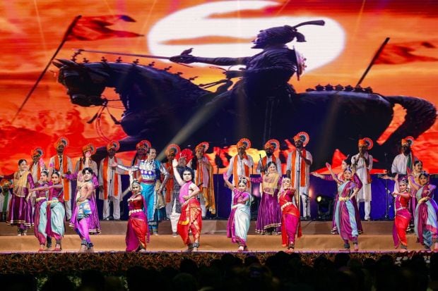 Artists perform during the inauguration of the redeveloped IECC complex at Pragati Maidan during the inaugural ceremony. Traditional musical instruments such as nadaswaram, thavil, panchavadyam, chenda, dappu, lezim, nashik dhol, Gujarat dhol, chattri, dhak dhol, nagara, shankh and ghant were used in the performances held against a backdrop of images from Indian mythology and of deities like Lord Shiva and Lord Ganesha. (Photo Credits: PTI)