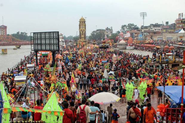Kanwariyas or Shiva devotees gather to collect holy water from the Ganga river for 'Kanwar Yatra'. (PTI Photo)