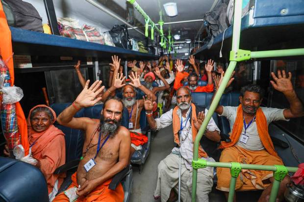 Jammu: Pilgrims raise religious slogans after boarding a bus as they leave for the Amarnath Yatra 2023, in Jammu. (PTI Photo)