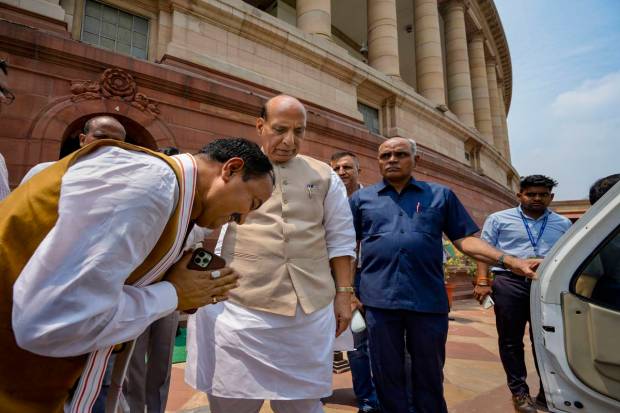 Defence Minister Rajnath Singh with Uttar Pradesh Deputy Chief Minister Keshav Prasad Maurya on the first day of Monsoon session of Parliament, in New Delhi. (PTI Photo)