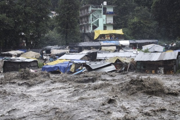A swollen River Beas following heavy rains in Kullu, Himachal Pradesh on July 9, 2023. According to local reports heavy rainfall has triggered landslides, damaged houses, and caused loss of lives. (Image: AP Photo/ Aqil Khan)