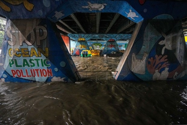 Road under Tilak Bridge gets waterlogged after heavy monsoon rains, at ITO in New Delhi. (Image: PTI Photo/Manvender Vashist Lav)