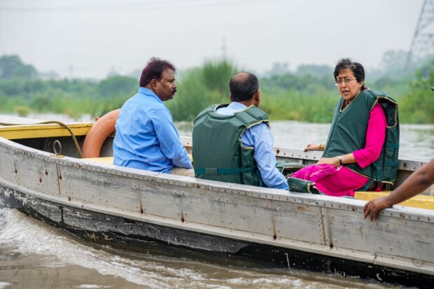 Delhi Education and PWD Minister Atishi inspects the water level of Yamuna river after heavy monsoon rains in New Delhi on July 10. (Image: PTI)
