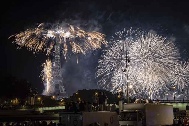 Fireworks illuminate the Eiffel Tower in Paris during Bastille Day celebrations on July 14, 2023. (AP Photo/Aurelien Morissard)