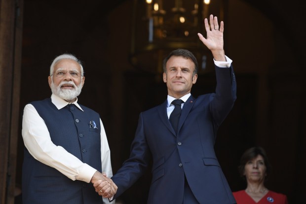 French President Emmanuel Macron and India's Prime Minister Narendra Modi shake hands prior to attending a meeting at the Foreign Affairs ministry in Paris. France is looking to further strengthen cooperation on an array of topics ranging from climate to military sales and the strategic Indo-Pacific region. (Image: AP/PTI)