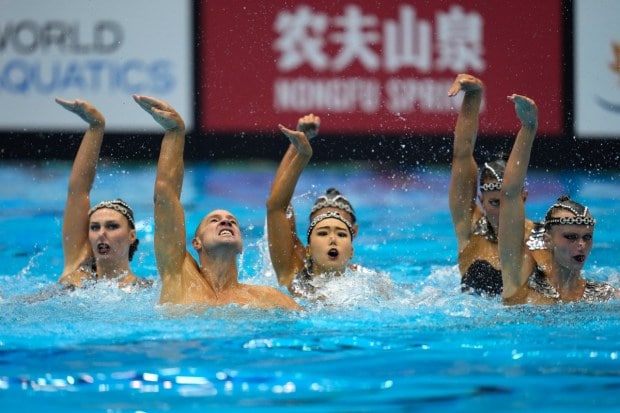 The United States team competes in the team acrobatic final of artistic swimming. (Image: AP)