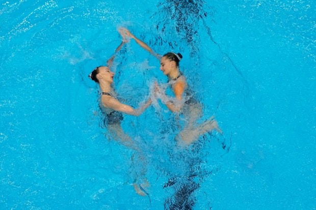 Anastasia Bayandina and Eve Planeix of France compete in the women's duet free of artistic swimming. (Image: AP)