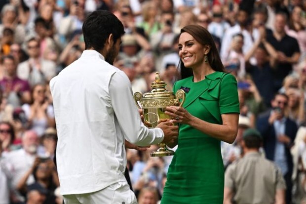 Alcaraz receives his trophy from Britain's Catherine, Princess of Wales. (Image: Reuters)