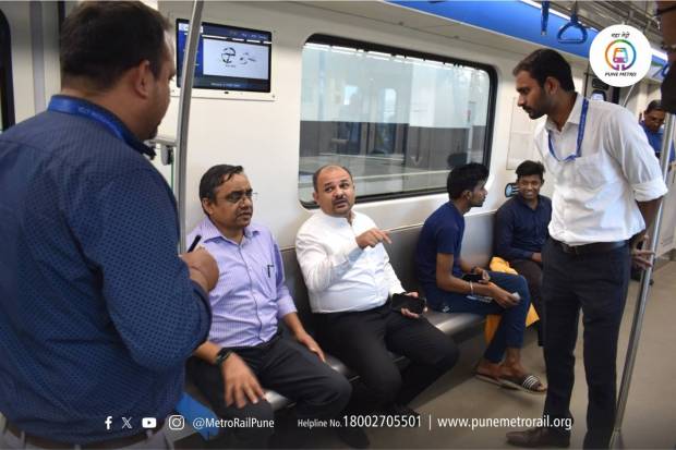 Managing Director of Mahametro Shravan Hardikar and Executive Director Dr. Hemant Sonawane (Administration and Public Relations) travel by metro. (Twitter-Pune Metro Rail)