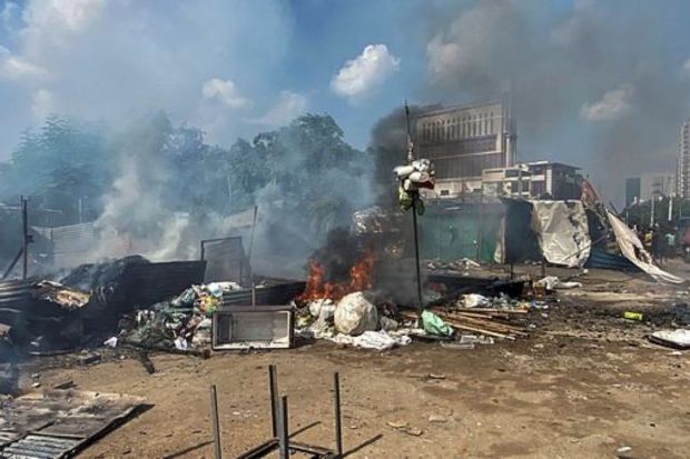 Flames and smoke rise from shops and other temporary structures, set ablaze by miscreants in a fresh case of communal violence in Gurugram. Violence erupted in Haryana's Nuh district on Monday after VHP's 'Brij Mandal Jalabhishek Yatra' was stopped by a group of young men near Khedla Mod and stones pelted at the procession. (Photo Credits: PTI)