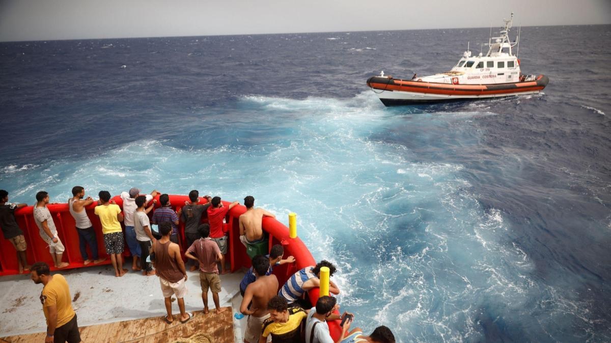 Immigration Rescue Italy's heroic rescue efforts save dozens of migrants in treacherous ...