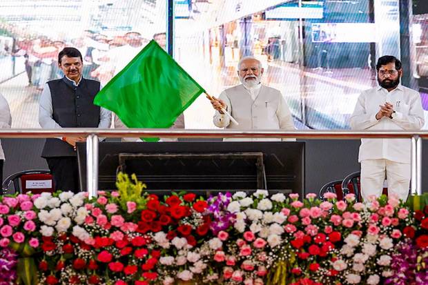 Prime Minister Narendra Modi flags off metro trains during a ceremony for the inauguration of various developmental projects, in Pune. (PTI Photo)