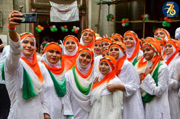 Students of Anjuman-E-Islam School and College take a selfie on the occasion of the 77th Independence Day, in Mumbai.. (PTI Photo)