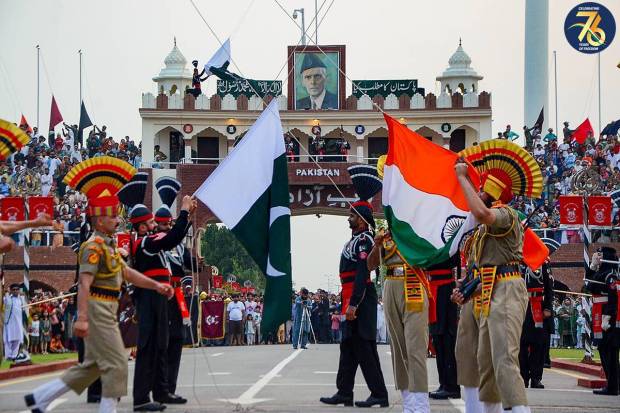 Border Security Force (BSF) and Pakistani Rangers personnel during the celebrations of the India's 77th Independence Day, at the Attari-Wagah border. (PTI Photo)