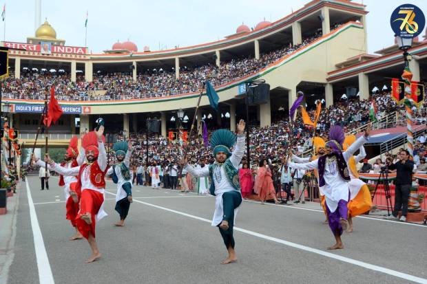 Artists perform during the beating retreat ceremony on the occasion of India's 77th Independence Day, at the Attari-Wagah border. (PTI Photo)