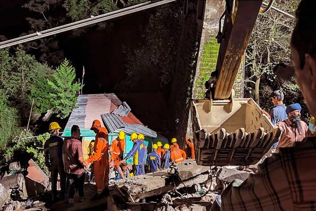 NDRF and SDRF personnel carry out rescue and relief work after a house collapsed near a crusher plant running in Helang, Joshimath. (PTI Photo)
