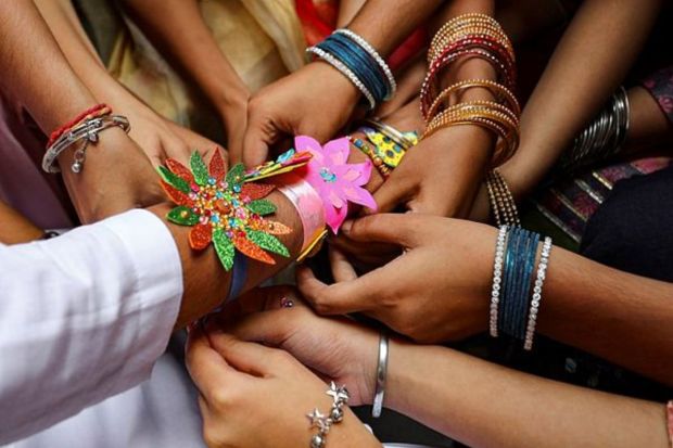 Raksha Bandhan celebrated with fervor across the nation. Women tie the thread on the wrist of their brothers or men they regard as brothers during this festival which celebrates the brother-sister relationship. (AP Photo)