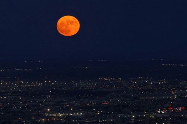 A Super Blue Moon rises above Ciudad Juarez, Mexico. A Blue Moon is usually classified as the second full moon which occurs in a single calendar month, according to NASA. (REUTERS)