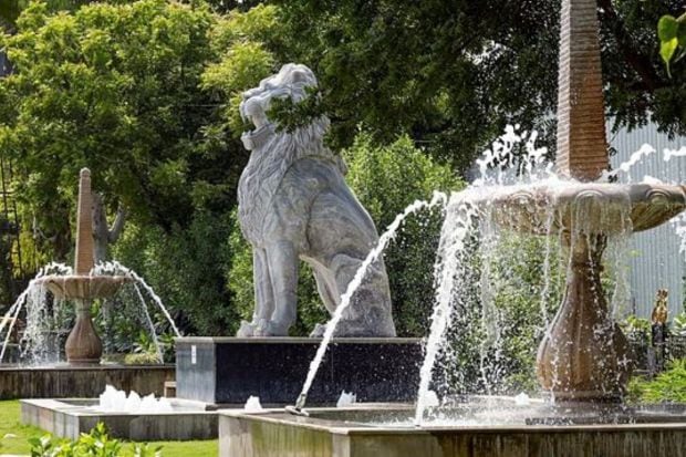 Stone-carved lion statue installed near the IGI Airport in preparation for the G20 Summit. (PTI Photo/Kamal Singh)