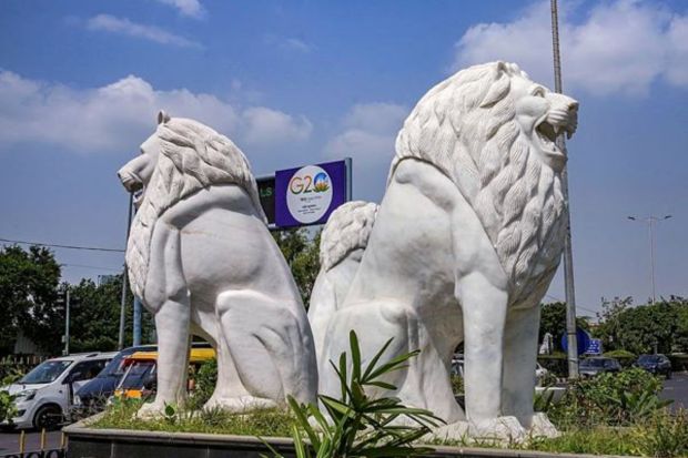 Stone-carved lion statue installed near the IGI Airport in preparation for the summit. (PTI Photo/Kamal Singh)