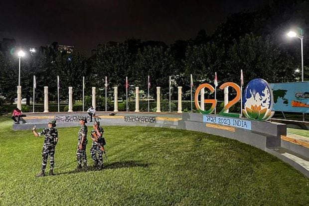 Paramilitary personnel take a selfie at a newly-developed 'G20 Park', in south Delhi. (PTI Photo/Kunal Dutt) 
