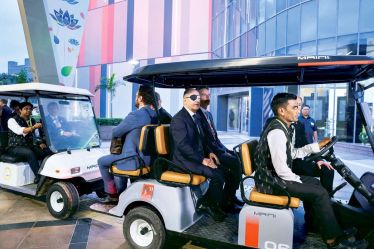 German Chancellor Olaf Scholtz sits on a golf cart, after attending a press conference, in New Delhi