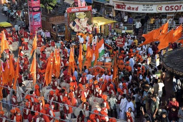 At the conclusion of the celebrations families immerse the idols. (Image: PTI)