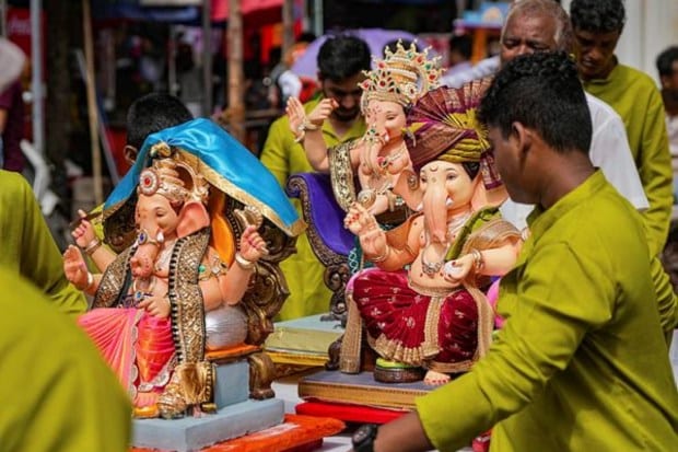 People were seen carrying the idols in autorickshaws, cars, and other modes of transport. (Image: PTI)