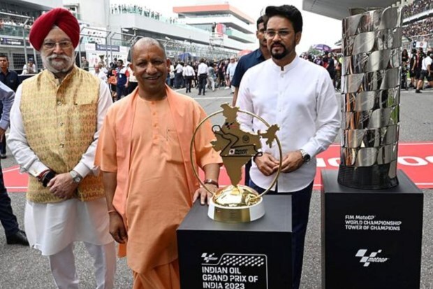 UP Chief Minister Yogi Adityanath and Union Ministers Anurag Thakur and Hardeep Singh Puri during the MotoGP on Sunday. (Image: PTI)