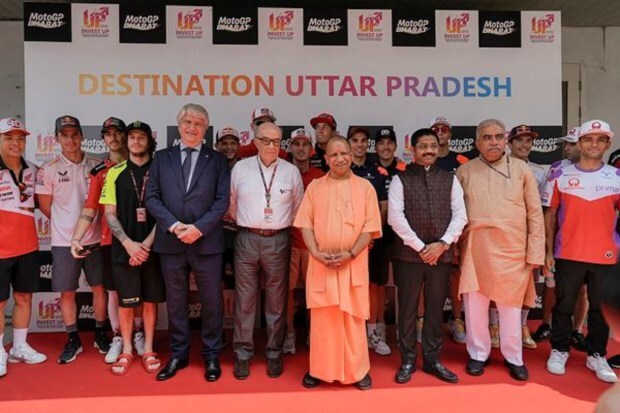 UP Chief Minister Yogi Adityanath, FIM President Jorge Viegas, Dorna CEO Carmelo Ezpeleta and UP Minister Nand Gopal Gupta pose for a group photo. (Image: PTI)