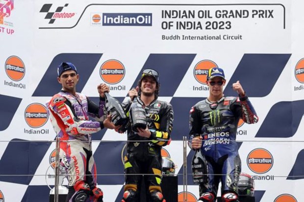 Italy's Marco Bezzecchi (c), Spanish rider Jorge Martín (R) and French rider Fabio Quartararo celebrate during the presentation ceremony of MotoGP race. (Image: Reuters)
