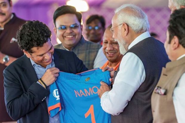 PM Modi being presented a jersey of the Indian team by former cricketer Sachin Tendulkar during the ceremony. (PTI Photo) 