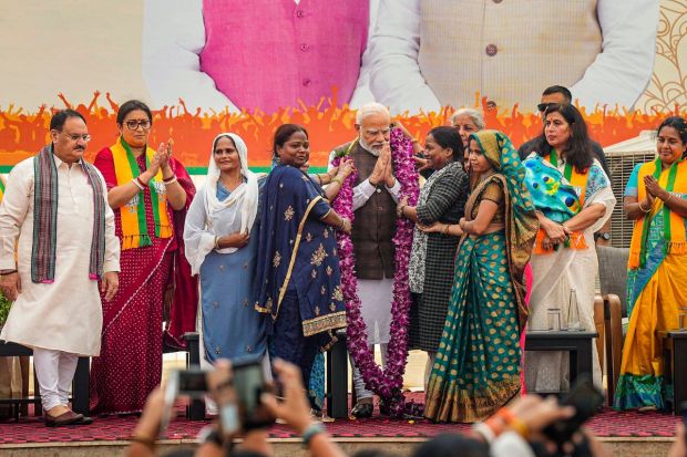 PM being felicitated during the 'Nari Shakti Vandan-Abhinandan Karyakram'. Union Minister Smriti Irani and BJP National President JP Nadda are also seen. (PTI Photo/Manvender Vashist Lav)