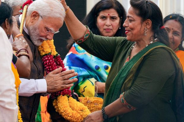 Modi being felicitated a day after Parliament passed the women's reservation bill at the BJP headquarters. Several women MPs across party lines set aside their differences to unequivocally call the passage of the Women's Reservation Bill, aptly titled 'Nari Shakti Vandan Adhiniyam', as historic. (PTI Photo/Arun Sharma)