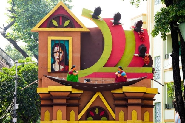 A community 'puja pandal' themed on 'surrogacy' during Durga Puja festival in Kolkata. (PTI Photo)