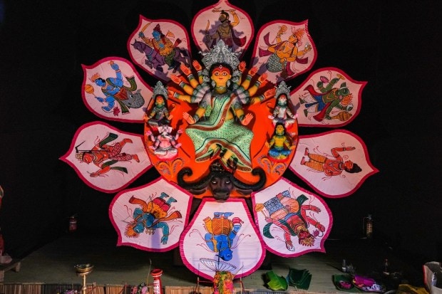 Devi Durga at a community Puja pandal on 'Maha Saptami' of the Durga Puja celebrations, in Kolkata. (PTI Photo)
