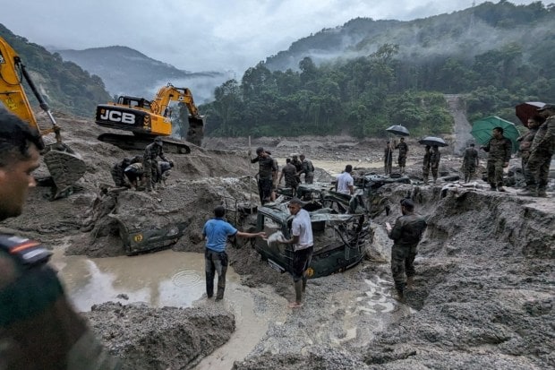 Of the 23 army personnel who were missing from Burdang area, the bodies of seven have been recovered from different areas downstream while one was rescued and the search is on for 15 missing jawans. (Reuters Photo)