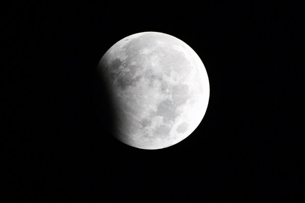 The type and length of a lunar eclipse depend on the Moon's proximity to the lunar node. A lunar eclipse is seen in the sky of New Delhi. (ANI Photo)