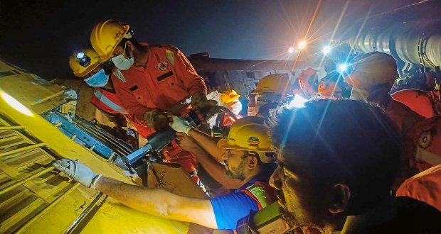 Rescue operation continue after several coaches of two passenger trains derailed after an accident in Vizianagaram district. (PTI Photo)