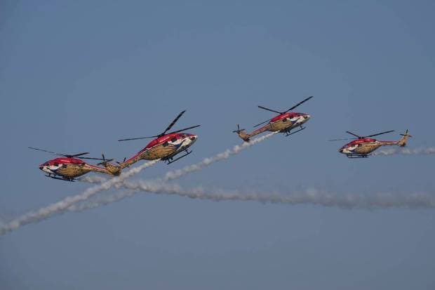 Indian Air Force (IAF) Sarang helicopters perform during full dress rehearsals for Air Force Day at Sangam, the holy confluence of river Ganga, Yamuna and the mythical Saraswati, in Prayagraj. (AP Photo)
