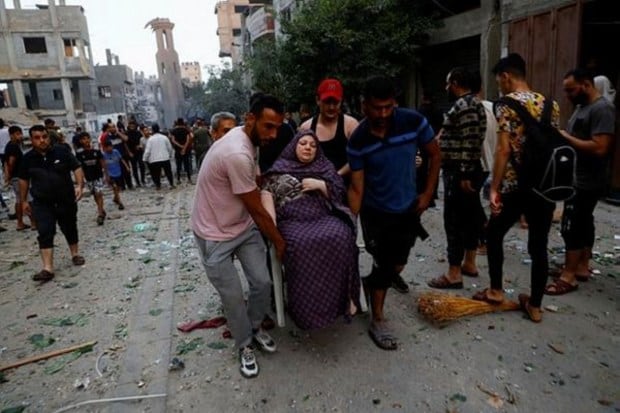 At least 700 people reportedly died in Israel and another 400 died in Gaza. Some 2,000 people have been wounded on each side. (Image: Reuters)